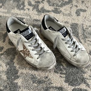 Gently worn GG Superstar. White base, gold glitter star and black glitter heel.